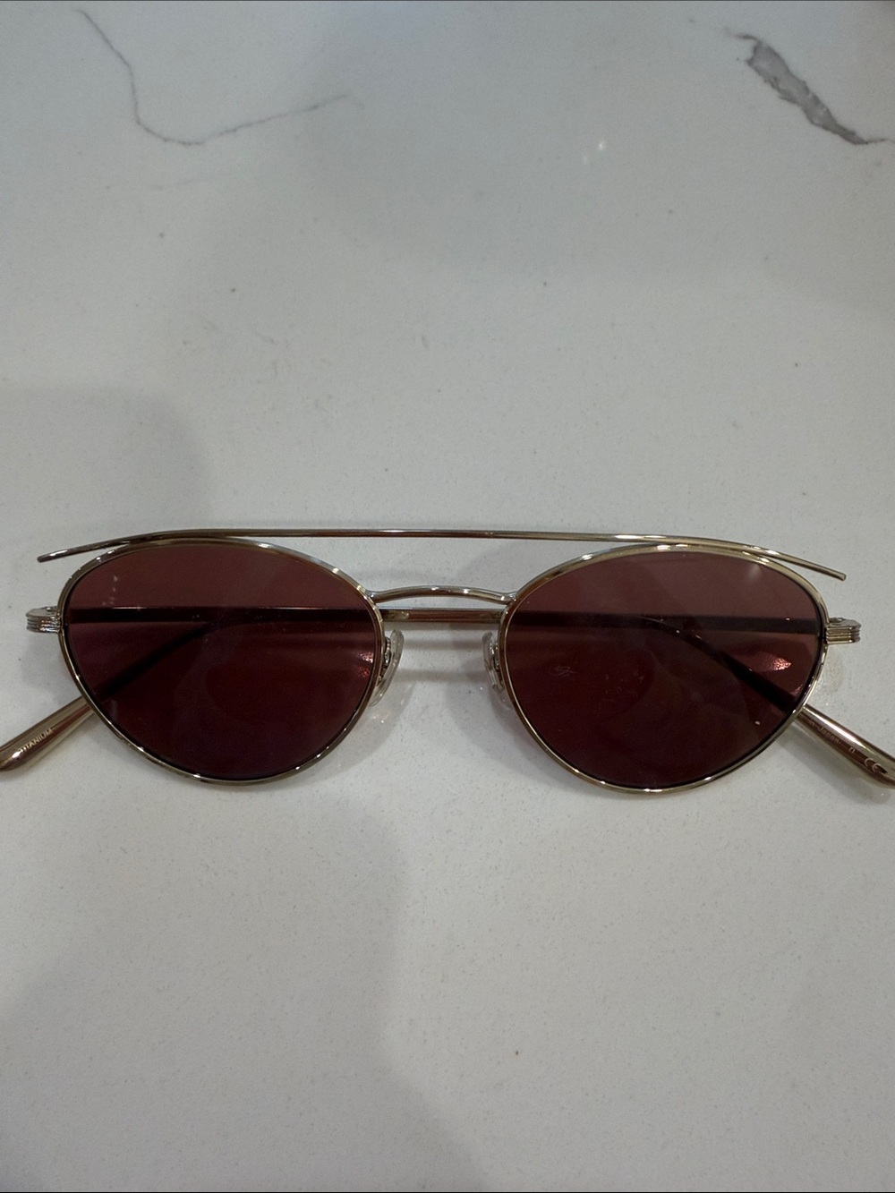 Oliver Peoples and the row Gold Frame Sunglasses with Dark Red Lenses